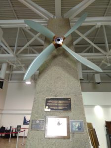 A propellar mounded on a conceret support pillar in the Gander Airport
